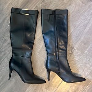 Calvin Klein, stiletto, knee-high black leather Glydia boots.